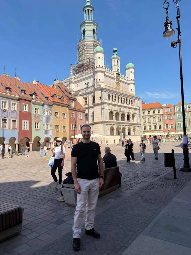 A young man stands in a street of Poland
